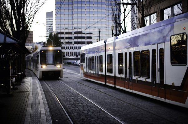 Portland streetcars on tracks at dusk